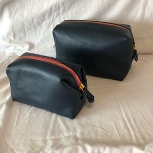 J Crew leather cosmetic/travel pouches navy blue with pink accent . GUC